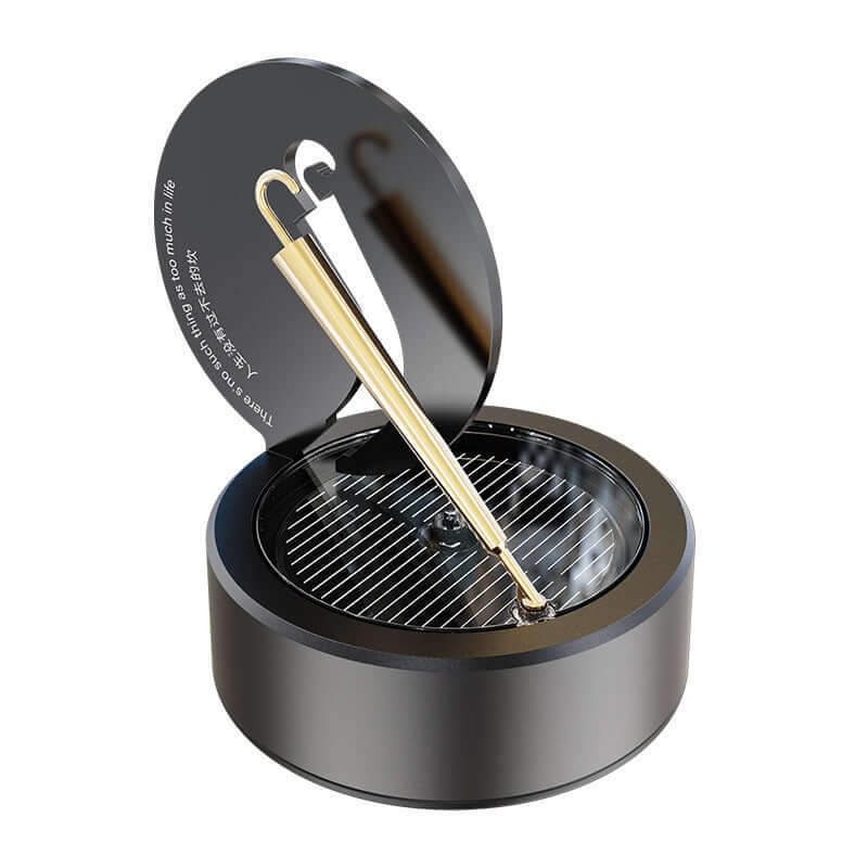 Solar rotating aromatherapy car air freshener in obsidian black with gold accent, featuring essential oil holder.
